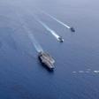 Aircraft carriers the USS Nimitz and USS Ronald Reagan sailing in Asia in July -- Washington is pushing back against Beijing over its military buildup in the South China Sea