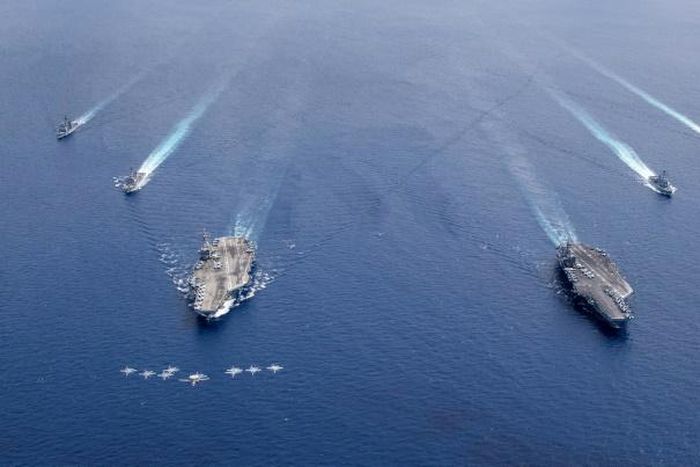 Aircraft carriers the USS Nimitz and USS Ronald Reagan sailing in Asia in July -- Washington is pushing back against Beijing over its military buildup in the South China Sea