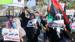 Libyans chant slogans during a demonstration over poor public services at Martyrs' Square in Tripoli on August 25, 2020