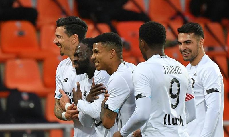 Jonathan Ikone (2ndL) celebrates with his teammates after scoring Lille's third goal in their win at Lorient on Sunday