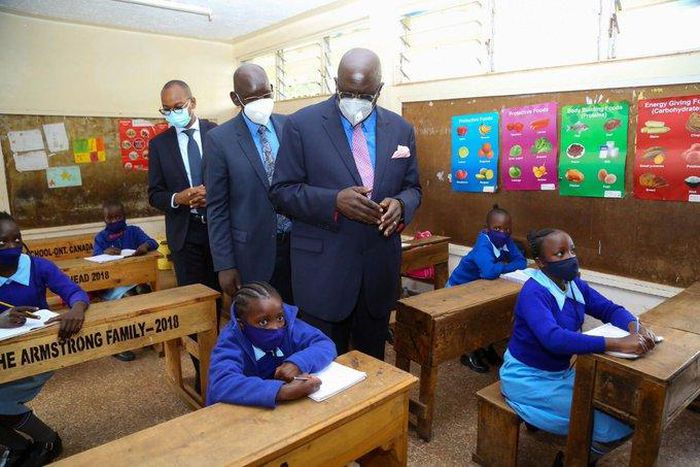 Education CS George Magoha with PS Belio Kipsang at the Olympic Primary School on day 1 of school re-opening following the Covid-19 break