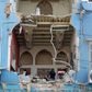 A Lebanese couple inspect the damage to their home in the capital's Gemmayzeh neighbourhood which overlooks the destroyed port of Beirut