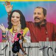 A man in Managua walks in April 2020 by a mobile health clinic displaying a picture of Nicaragua's President Daniel Ortega and his wife, Vice President Rosario Murillo, whose son Juan Carlos Trujillo has been hit by US sanctions