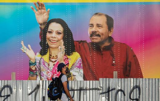 A man in Managua walks in April 2020 by a mobile health clinic displaying a picture of Nicaragua's President Daniel Ortega and his wife, Vice President Rosario Murillo, whose son Juan Carlos Trujillo has been hit by US sanctions