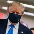 President Donald Trump makes a rare appearance in a mask as part of a new attempt to restore his standing with Americans over the handling of the coronavirus pandemic