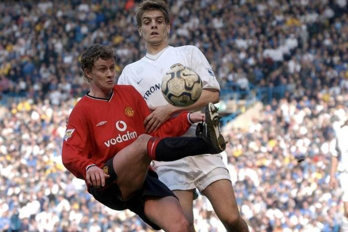 Ole Gunnar Solskjaer in action against Jonathan Woodgate of Leeds as a Manchester United player
