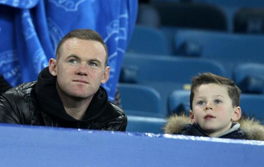 Former Manchester United forward Wayne Rooney pictured with his son, Kai, in 2015