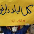 Peace demand: A demonstrator in Khartoum on July 4 holds up a sign reading 'All of the country is Darfur - #PeaceFirst'