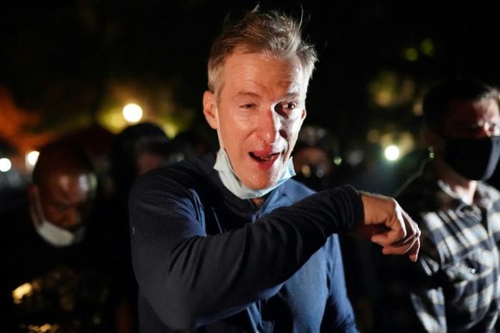 Portland Mayor Ted Wheeler reacts after being tear gassed by federal officers while attending a protest against police brutality and racial injustice on July 22, 2020 in Portland, Oregon