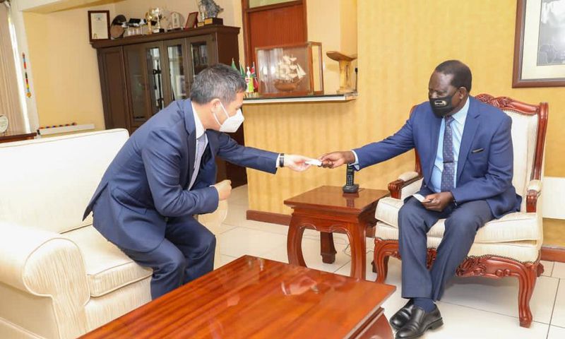 Former Prime Minister Raila Odinga with China's Ambassador to Kenya Zhou Pingjian at his Capitol Hill offices