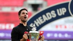 Arsenal boss Mikel Arteta holds the FA Cup trophy