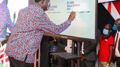 Former Prime Minister Raila Odinga signing the BBI constitutional amendment bill
