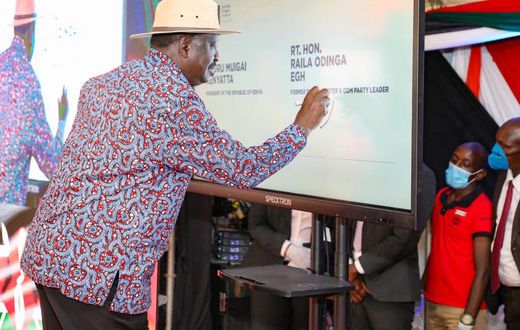 Former Prime Minister Raila Odinga signing the BBI constitutional amendment bill