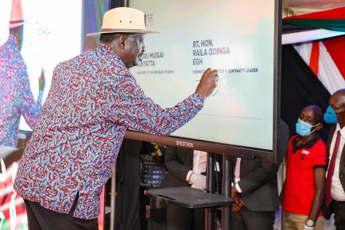 Former Prime Minister Raila Odinga signing the BBI constitutional amendment bill