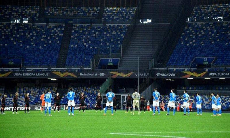 Players hold a minute's silence for Italy's 1982 World Cup winner Paolo Rossi in their first match at the renamed Diego Armando Maradona stadium in Naples.