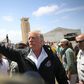 Donald Trump waves to a crowd during a 2017 visit to Puerto Rico, which the US president is accused of wanting to sell
