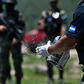 Members of Honduras's criminal investigation agency prepare to burn 250,000 kilograms of cocaine seized during the month of May 2020