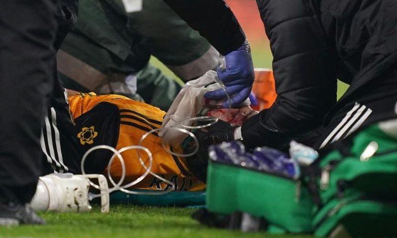 Wolves forward Raul Jimenez receives treatment after a clash of heads with Arsenal's David Luiz