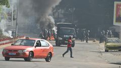Five people have been killed and over 100 injured in three days of street clashes following President Alassane Ouattara's decision to seek a third term, the government said, urging calm.