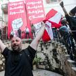 Lebanese protesters celebrate storming the Ministry of Foreign Affairs in Beirut