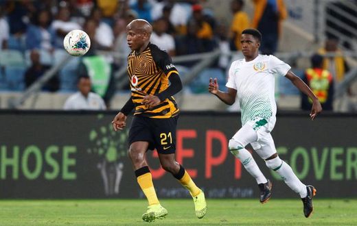 Kaizer Chiefs star Lebogang Manyama (L) is pursued by a Bloemfontein Celtic opponent during a South African Premiership match this season