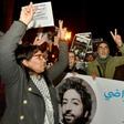 Demonstrators shout slogans in support of Omar Radi (pictured on the banner), a Moroccan journalist detained over tweet criticising judge, during a demonstration, on December 28, 2019, in the city of Rabat