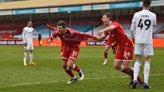 Crawley's Jordan Tunnicliffe (C) celebrates after scoring against Leeds