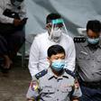 David Lah is escorted for trial in Yangon on June 8