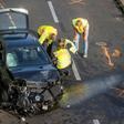 The mangled black Opel Astra on Berlin's Autobahn 100 after its driver caused three accidents