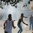 Lebanese protesters hurl rocks towards security forces during clashes in downtown Beirut