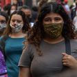 People walk along a commercial street, in downtown Sao Paulo, Brazil on August 4, 2020, amid the new coronavirus pandemic