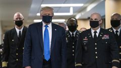 The man in the presidential mask: Donald Trump wore a face mask for the first time in public