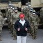 US President Donald Trump poses with National Guard troops in Lake Charles, Louisiana, on August 29, 2020 on a trip to survey damage from Hurricane Laura