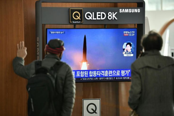 People watch footage of a North Korean missile test at a railway station in Seoul