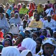 Members of the public crowded without Covid-19 safety precautions during a campaign rally for one of the by-election candidates
