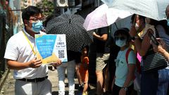 Thousands queued in the intense summer heat at unofficial polling stations across the city hours after police raided an opinion pollster helping to conduct the vote