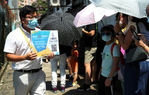 Thousands queued in the intense summer heat at unofficial polling stations across the city hours after police raided an opinion pollster helping to conduct the vote