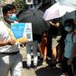 Thousands queued in the intense summer heat at unofficial polling stations across the city hours after police raided an opinion pollster helping to conduct the vote