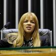 Famous for adopting dozens of street children from Rio de Janeiro's slums, Congresswoman Flordelis dos Santos is accused of ordering her children to murder her husband, a fellow pastor, in a dispute over money and power