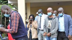 Lawrence Warunge Njoroge being led out of court following a past hearing
