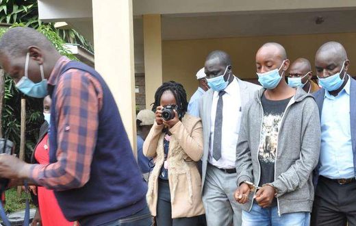 Lawrence Warunge Njoroge being led out of court following a past hearing