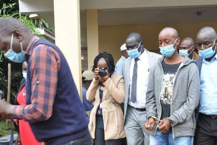 Lawrence Warunge Njoroge being led out of court following a past hearing