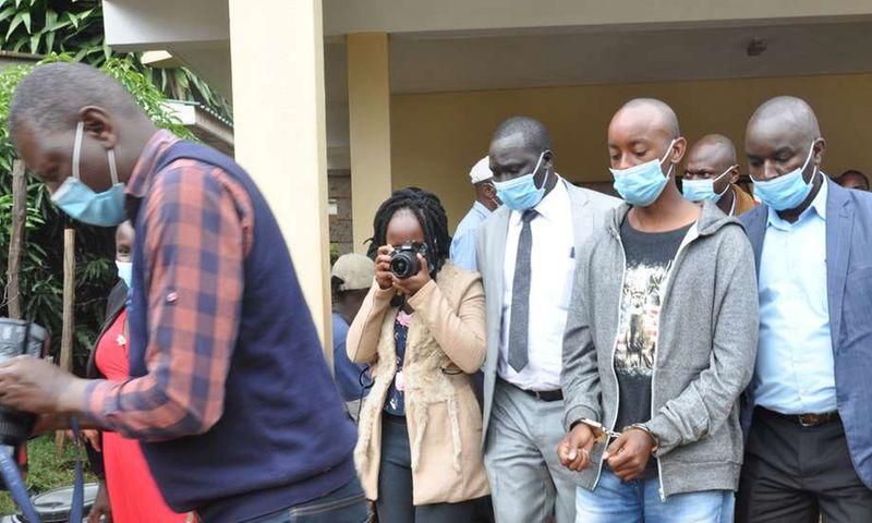 Lawrence Warunge Njoroge being led out of court following a past hearing