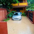 Floodwaters encircle a home in Pietonville, Haiti, after Storm Laura