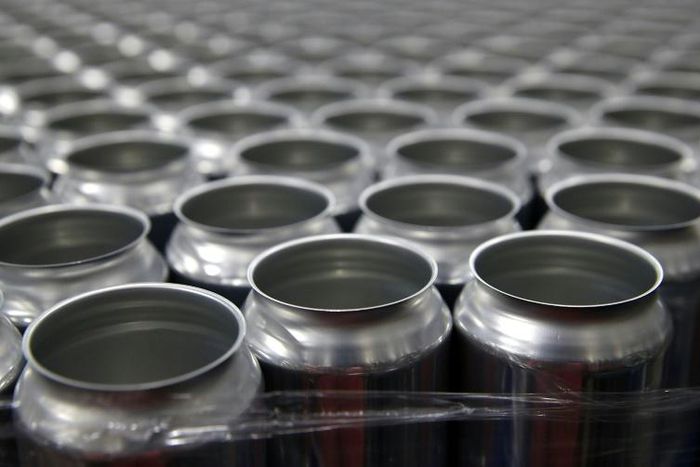 US President Donald Trump has said he was reimposing a 10 percent tariff on Canadian aluminum; In this file photo stacks of empty aluminum cans sit on a pallet before being filled with beer at Devil's Canyon Brewery in San Carlos, California