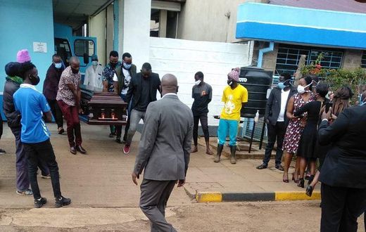 Ruth Matete picks the remains of her late husband Beloved John from the KNH morgue