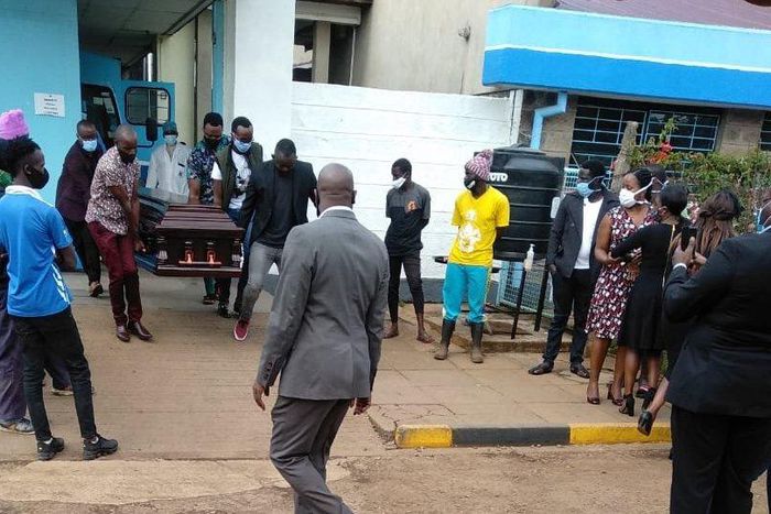 Ruth Matete picks the remains of her late husband Beloved John from the KNH morgue