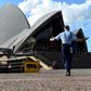 Police patrol near the Sydney Opera House, an area usually thronged with tourists, during Australia's coronavirus outbreak