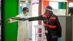 A traveler goes through checks at a local airport