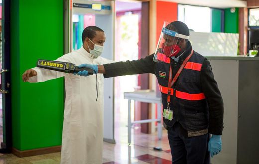 A traveler goes through checks at a local airport